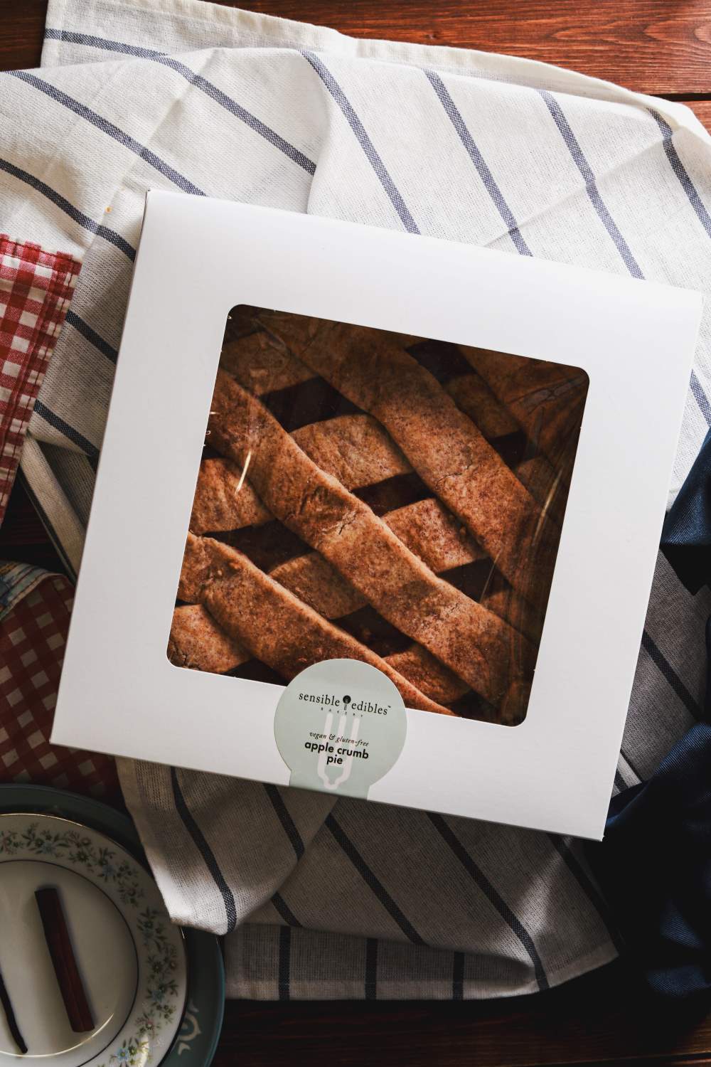 Packaged apple pie with a lattice crust in a white box with a window, from Sensible Edibles.