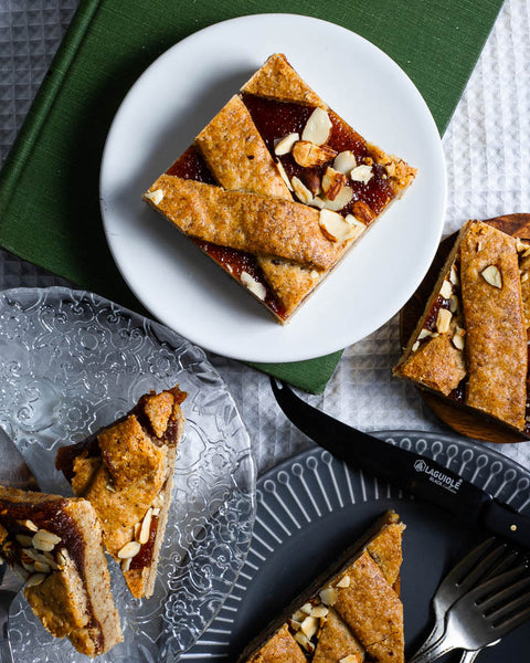 Apricot almond bar on a white plate.