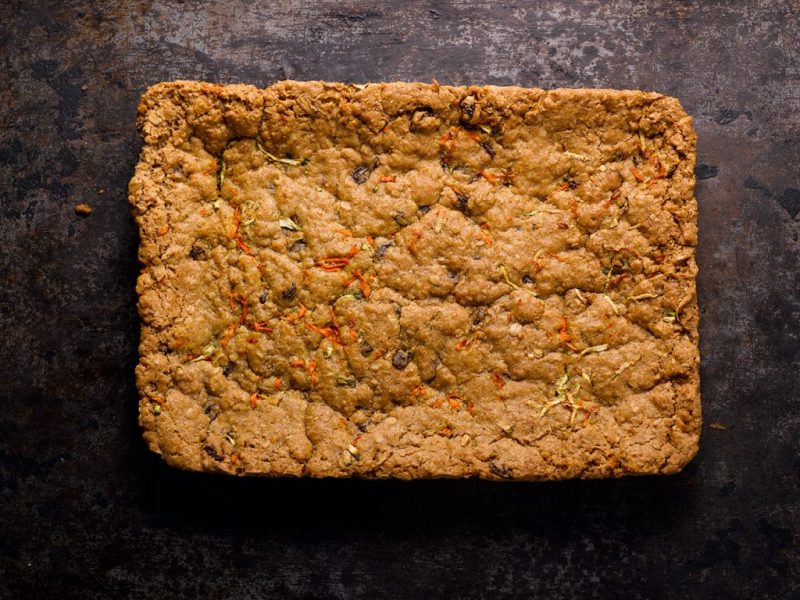 Whole grassroot slab on a dark textured surface.