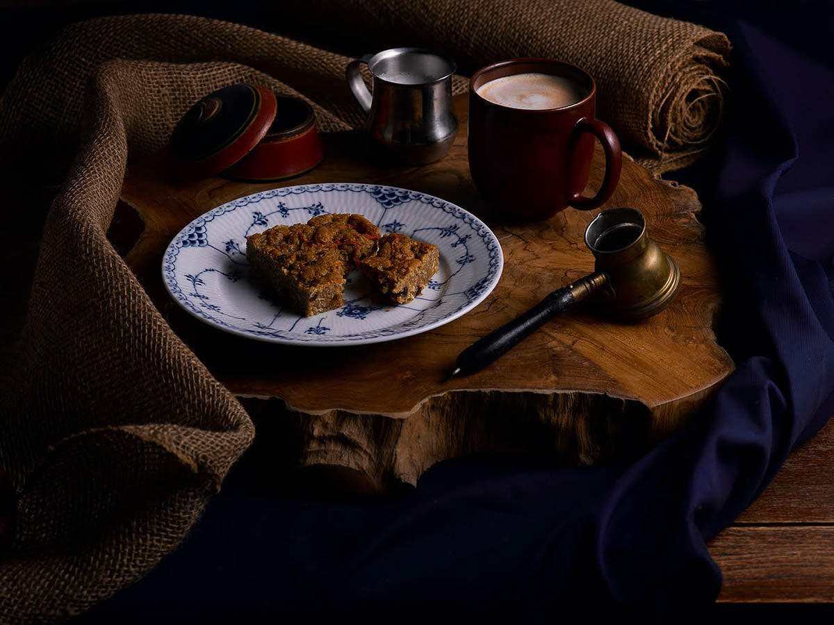 Grassroot bar on a decorative plate with a cup of coffee and rustic decor.